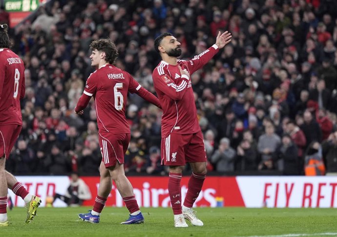 14 February 2026, United Kingdom, Liverpool: Liverpool's Mohamed Salah celebrates scoring his side's third goal during the English FA Cup fourth round soccer match between Liverpool and Brighton and Hove Albion at Anfield. Photo: Peter Byrne/PA Wire/dpa