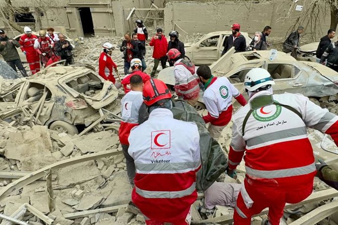 March 16, 2026, Tehran, Iran: Rescue teams from the Iranian Red Crescent Society (IRCS) are working at the site of a building destroyed by an airstrike in Tehran. The United States and Israel launched strikes on Iran on February 28, killing Iranian Suprem