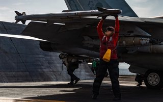 March 19, 2026, Undisclosed Location, International Waters: A U.S Navy ordnancemen checks the missiles of a F/A-18E Super Hornet fighter aircraft with the Tomcatters of Strike Fighter Squadron 31, before launch from the flight deck of the Ford-class aircr