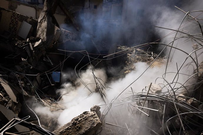 March 18, 2026, Beirut, Beirut, Lebanon: Smoke rises from a residential building leveled by an early-morning Israeli attack in central Beirut, Lebanon on March 18, 2026. At least 12 people have been killed and 41 injured by IsraelĂ•s attacks targeting cen