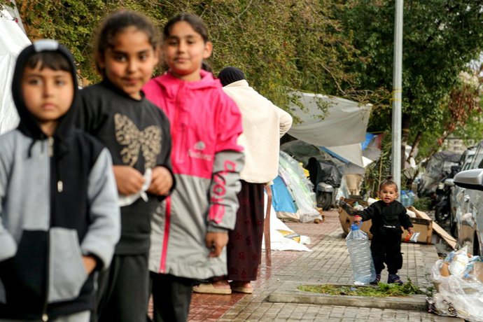 March 21, 2026, Beirut, Beirut, Lebanon: Lebanese displaced children stand outside their camping tents erected on a pavement just outside Beirut southern suburb, a stronghold of pro-Iranian Hezbollah. More than one million Lebanese were displaced from the
