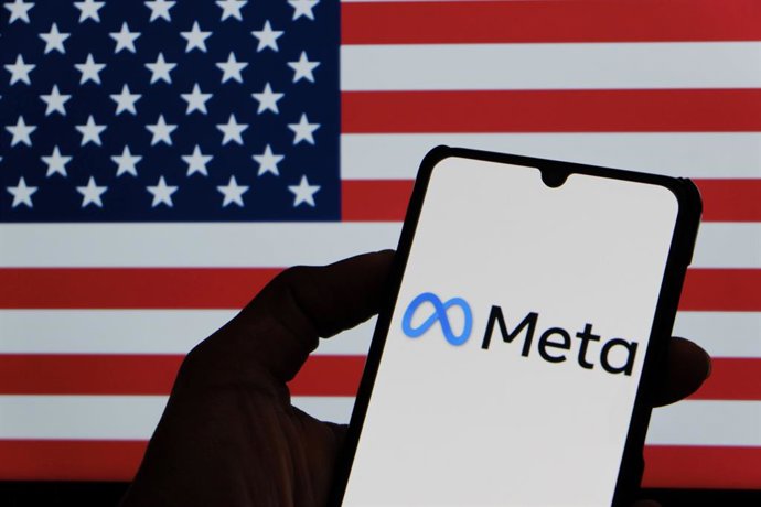 Archivo - September 25, 2025, Bandung, West Java, Indonesia: In this photo illustration, Meta logo is displayed on a smartphone with national flag US in the background.