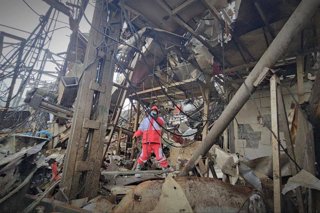 March 11, 2026, Naqadeh, West Azerbaijan, Iran: Rescue teams from the Iranian Red Crescent Society (IRCS) are working at the site of a building damaged by an airstrike in Naqadeh, West Azerbaijan province, Iran. On February 28, 2026, Washington coordinate