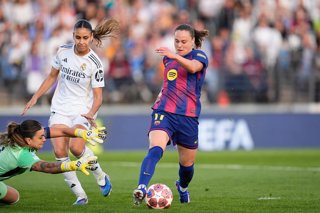Ewa Pajor of FC Barcelona and Misa Rodriguez of Real Madrid compete for the ball during the UEFA Women’s Champions League 2025/26, Quarter-finals first leg football match played between Real Madrid CF and FC Barcelona at Alfredo Di Stefano stadium on Marc