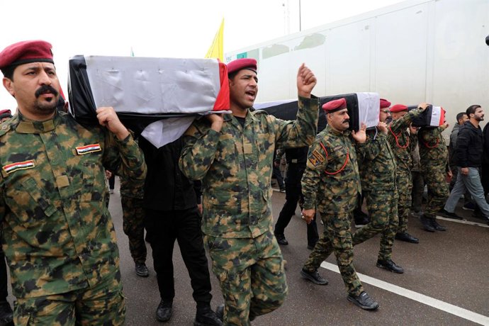 BAGHDAD, March 24, 2026  -- People attend a funeral for deceased Iraqi paramilitary Popular Mobilization Forces (PMF) members in Baghdad, Iraq, on March 24, 2026. A U.S. airstrike killed 15 members of Iraq's paramilitary Popular Mobilization Forces (PMF),