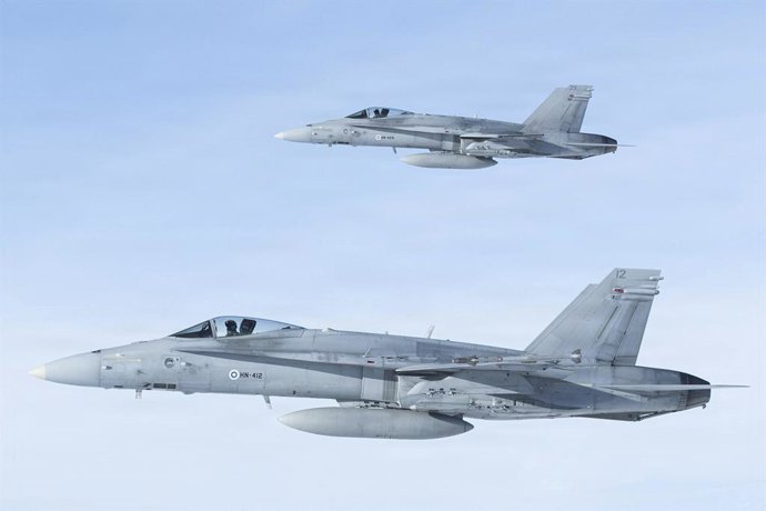 March 18, 2026, Evenes Air Station, Norway: Finnish Air Force F/A-18 Hornet fighter aircraft pull alongside a U.S Air Force KC-130J Super Hercules aircraft during joint training operation Cold Response 26, March 16, 2026 near Evenes Air Station, Norway.