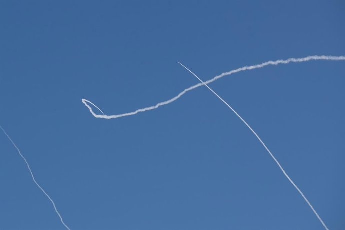 TEL AVIV, March 1, 2026  -- This photo taken on March 1, 2026 shows smoke trails left by interceptor missiles launched from Israeli air defense systems in downtown Tel Aviv, Israel. Multiple explosions were heard in Tel Aviv on Sunday, eyewitnesses said, 