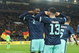 30 March 2026, Baden-Wuerttemberg, Stuttgart: Germany's Deniz Undav celebrates scoring his side's second goal with teammate Antonio Ruediger (L) during the International Friendly soccer match between Germany and Ghana at MHP Arena. Photo: Christian Charis