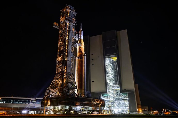 19 March 2026, US, Merritt Island: NASA's Space Launch System (SLS) rocket, with the Orion capsule atop, is seen slowly rolling out of the Vehicle Assembly Building (VAB) at the agency's Kennedy Space Center in Florida, on its journey to Launch Complex 39