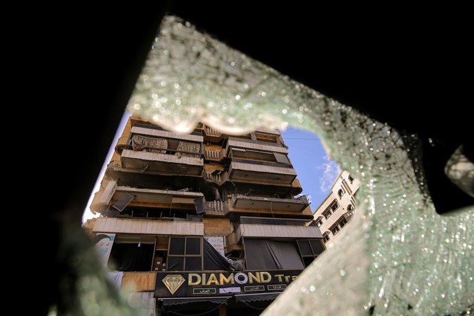 March 30, 2026, Beirut, Lebanon: An apartment that was targeted by an Israeli air raid on the edge of Beirut's southern suburb, stronghold of pro-Iranian Hezbollah, is seen from the shattered glass of a destroyed car. Lebanon was pulled into the Middle Ea