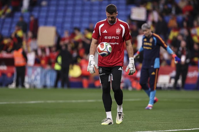 Unai Simon of Spain warms up during the International friendly match played between Spain Team and Egypt at RCDE Stadium on March 31, 2026 in Cornella, Spain.