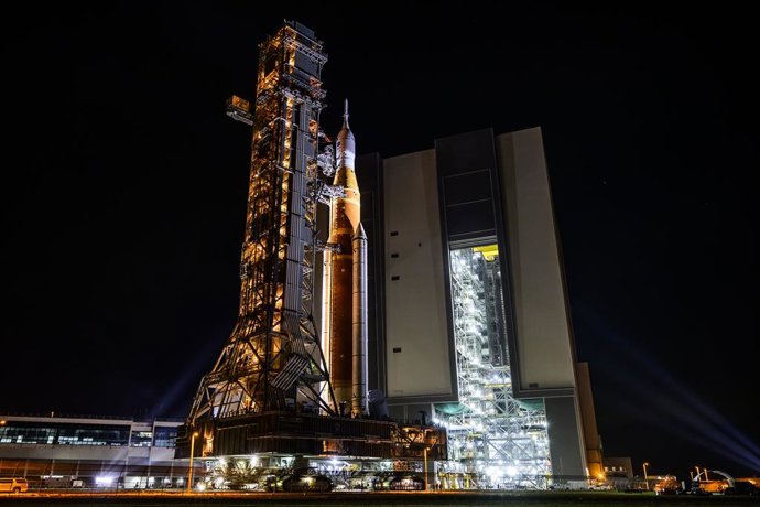 19 March 2026, US, Merritt Island: NASA's Space Launch System (SLS) rocket, with the Orion capsule atop, is seen slowly rolling out of the Vehicle Assembly Building (VAB) at the agency's Kennedy Space Center in Florida, on its journey to Launch Complex 39