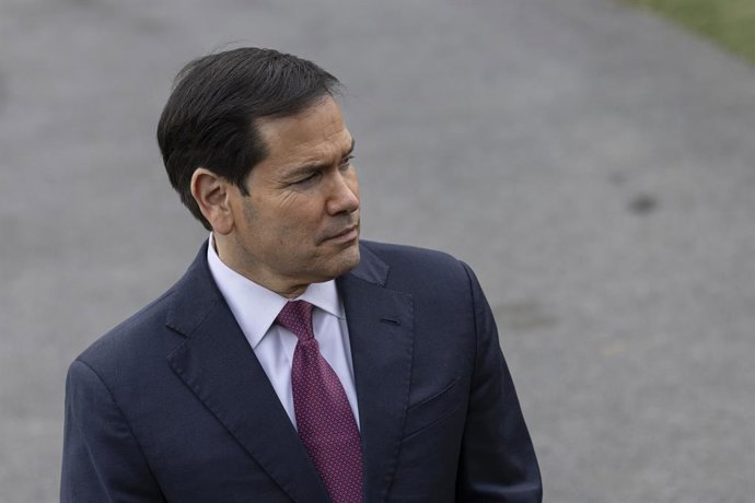 March 20, 2026, Washington, District Of Columbia, United States: U.S. Secretary of State Marco Rubio looks on as U.S. President Donald Trump speaks to journalists  before departing the White House on March 20, 2026, in Washington D.C. President Trump is t
