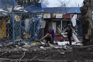 April 3, 2026, Kramatorsk, Donetsk Region, Ukraine: People recovering among the rubble at the site of air strike by a guided air bomb which hit right next to a small corner grocery store.