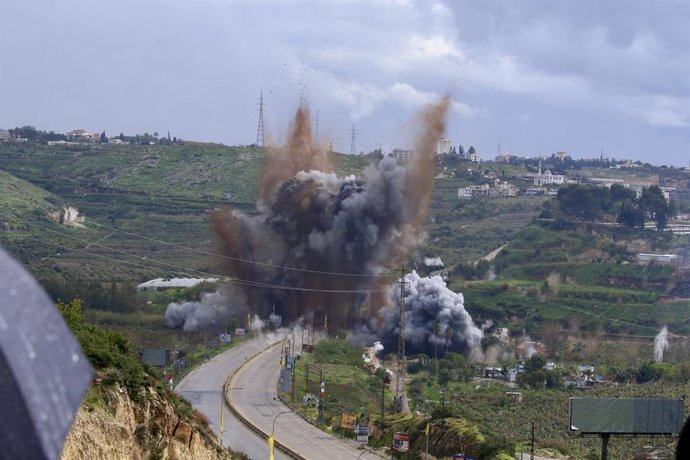 QASMIYEH, March 23, 2026  -- This photo taken on March 22, 2026 shows an explosion during an Israeli airstrike on a bridge over the Litani River in Qasmiyeh, southern Lebanon.   Israeli warplanes struck the strategic Qasmiyeh Bridge over the Litani River 