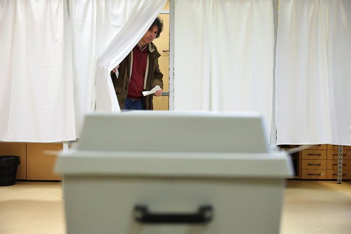 BUDAPEST, April 12, 2026  -- A voter is pictured at a polling station in Budapest, Hungary, April 12, 2026. Hungary's parliamentary elections kicked off at 6:00 a.m. local time (0400 GMT) on Sunday, with about 8.1 million eligible voters, according to the