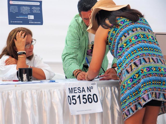 April 12, 2026, Lima, Lima, Peru: Woman casting her vote in a voting center while most Peruvian citizens queue up to cast their vote in schools, universities and sports centers throughout the country in the 2026 general elections.