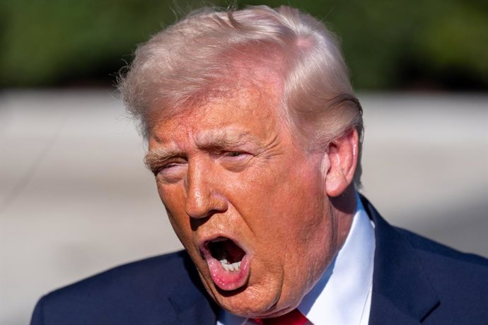 April 11, 2026, Washington, District of Columbia, USA: President DONALD TRUMP speaks to the media before departing on Marine One from the South Lawn of the White House.