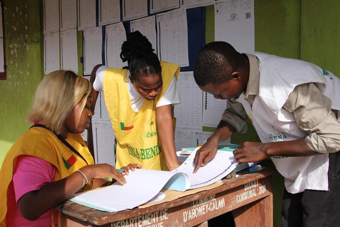COTONOU, April 13, 2026  -- Staff members count ballots at a polling station in Cotonou, Benin, April 12, 2026. Vote counting for the first round of Benin's presidential election began Sunday following the closure of polling stations, Xinhua observed in C