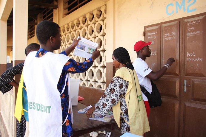 COTONOU, April 13, 2026  -- Staff members count ballots at a polling station in Cotonou, Benin, April 12, 2026. Vote counting for the first round of Benin's presidential election began Sunday following the closure of polling stations, Xinhua observed in C