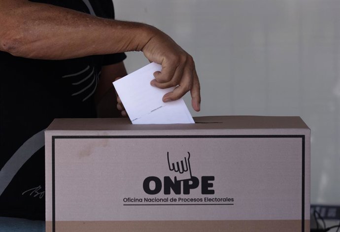 LIMA, April 13, 2026  -- A voter casts a ballot at a polling station in Lima, Peru, April 12, 2026. Peruvian President Jose Balcazar on Sunday urged citizens to vote with "calm and serenity" as the country holds general elections to choose a new president
