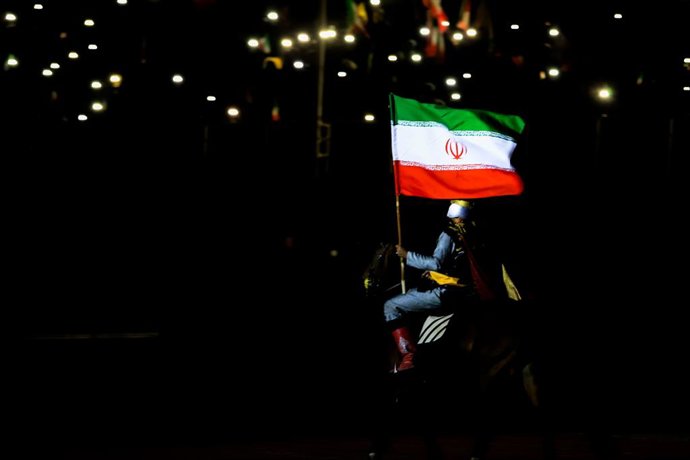 April 14, 2026, Iran, Iran: Pro-government supporters wave national flags during a state-organised rally, amid a ceasefire in the conflict involving Iran, the United States, and Israel. The ceasefire remained in place, but peace talks held in Islamabad on