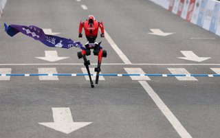 BEIJING, April 19, 2026  -- Humanoid robot "Flash" of Pofengshandian Team in the remote-controlled category crosses the finish line during the Beijing E-Town half-marathon and humanoid robots half-marathon in the Beijing Economic-Technological Development