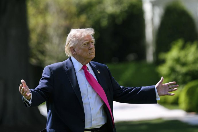 April 20, 2026, Washington, Dc, United States of America: U.S President Donald Trump, gestures to the media pool before boarding Marine One on the South Lawn of the White House, April 16, 2026 in Washington, D.C. Trump departed to Joint Base Andrews then 