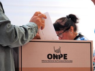 April 12, 2026, Lima, Lima, Peru: Man casting his vote in a voting center while most Peruvian citizens queue up to cast their vote in schools, universities and sports centers throughout the country in the 2026 general elections.