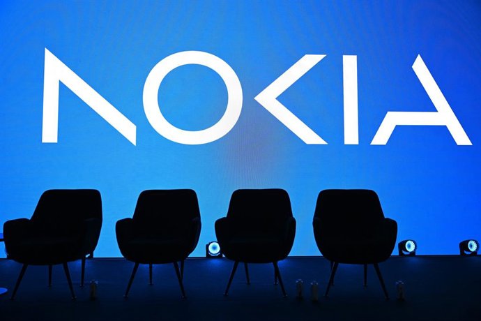 Archivo - FILED - 01 March 2026, Spain, Barcelona: After a marketing event of the network technology company Nokia, chairs stand on the empty stage, behind which the Nokia logo can be seen on a screen. The Finnish manufacturer of antennas and other cell p