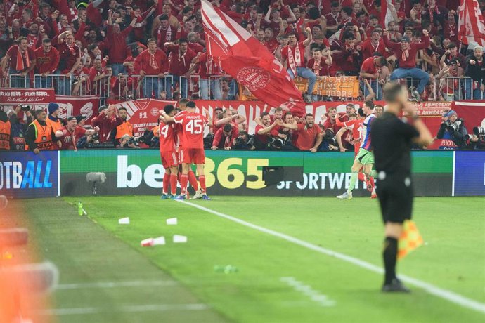 April 15, 2026, Munich, Bavaria, Munich: MUNICH, GERMANY - APRIL 15: Fans and players celebrating the winning goal in front of the Sudkurve during a UEFA Champions League 2025/26 match between Bayern Munich and Real Madrid in Munich on April 15, 2026