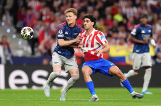 29 April 2026, Spain, Madrid: Arsenal's Martin Odegaard (L) and Atletico Madrid's Joao Lucas Johnny battle for the ball during the UEFA Champions League semifinal 1st leg soccer match between Atletico Madrid and Arsenal at the Riyadh Air Metropolitano.
