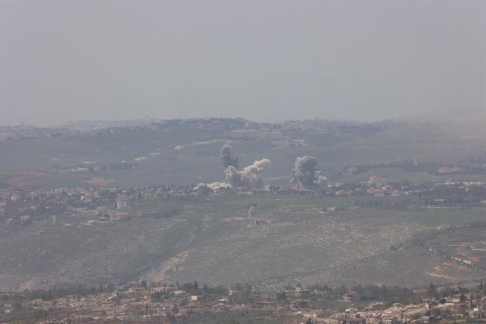 KIRYAT SHMONA, April 27, 2026  -- Smoke rises from a site in southern Lebanon following an Israeli strike as seen from northern Israel, April 26, 2026. Israeli Prime Minister Benjamin Netanyahu has ordered the military to forcefully strike Hezbollah targe
