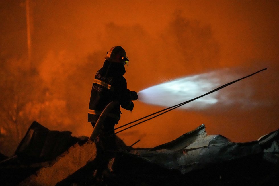 CHANGSHA, May 5, 2026  -- A rescuer works on site after an explosion at a fireworks plant in Guandu Town of Liuyang, central China's Hunan Province, May 5, 2026.