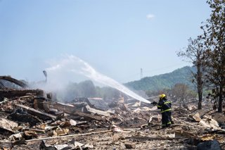 CHANGSHA, May 5, 2026  -- Rescuers work on site after an explosion at a fireworks plant in Liuyang, central China's Hunan Province, May 5, 2026. The fireworks plant explosion on Monday in central China's Hunan Province has left 26 people dead and 61 other