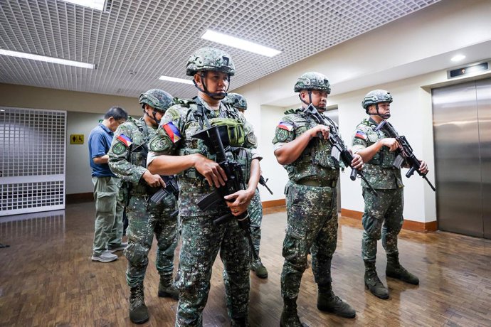 PASAY CITY, May 13, 2026  -- Soldiers are seen inside the Philippine Senate complex in Pasay City, the Philippines, on May 13, 2026. Philippine Senate President Alan Peter Cayetano said on Wednesday that the Senate was "under attack," amid tensions surrou