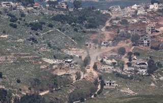 ISRAEL-LEBANON BORDER, May 12, 2026  -- A military vehicle of the Israeli Defense Forces patrols in southern Lebanon, as seen from northern Israel, on May 11, 2026. At least seven people were killed and seven others wounded in Israeli strikes across south