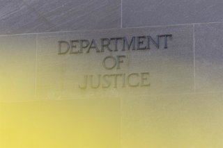 Archivo - February 20, 2026, Washington, District Of Columbia, United States: The Department of Justice sign is seen on the exterior of the United States Department of Justice headquarters.