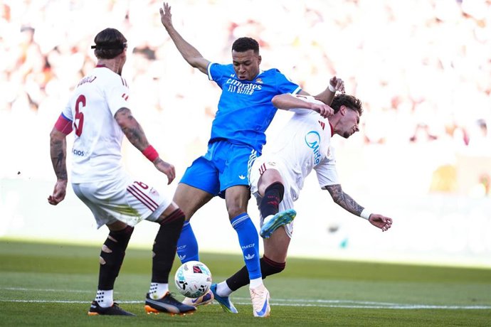 Kylian Mbappe of Real Madrid CF and Kike Salas of Sevilla FC in action during the Spanish league, LaLiga EA Sports, football match played between Sevilla FC and  Real Madrid at Ramon Sanchez-Pizjuan stadium on May 17, 2026, in Sevilla, Spain.