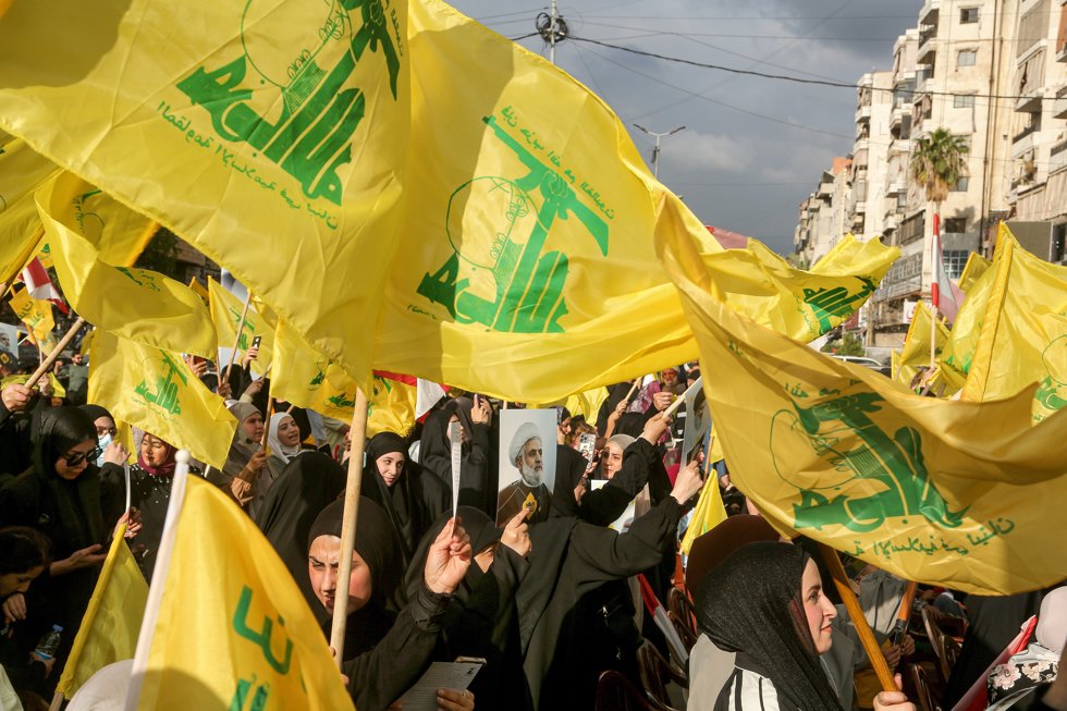 25 May 2026, Lebanon, Beirut: Pro-Iranian Hezbollah supporters wave the party flags during a ceremony in the devastated Beirut southern suburb to celebrate the 26th anniversary of the Resistance and Liberation Day, which marks Israel's withdrawal from 