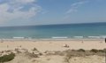 La playa de La Barrosa en Chiclana (Cádiz) recibe 50.000 metros cúbicos de arena tras los daños por las borrascas