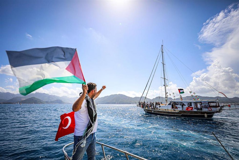 Activists, journalists and medics gather aboard boats during the departure of the Global Sumud Flotilla mission from Marmaris, Turkeye, and set sail for Gaza in an international humanitarian effort aimed at challenging the blockade. 