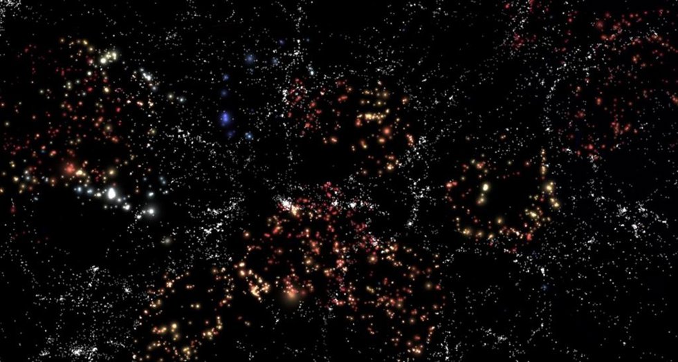 Representación de la estructura a gran escala del Universo. Las galaxias coloreadas representan las galaxias en vacíos usadas en CAVITY. El color y tamaño de las galaxias no está representado a escala. Créditos: Andoni Jiménez.