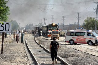 QUETTA, May 24, 2026  -- Emergency vehicles arrive at the site of a train shuttle blast in Quetta, Balochistan province, Pakistan, May 24, 2026.   At least 24 people were killed and 82 others injured in a blast targeting a shuttle of the Jaffar Express in