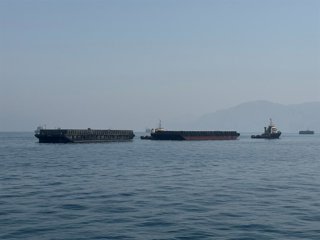 KHASAB, May 29, 2026  -- This photo taken with a mobile phone shows merchant vessels stranded in the waters of the Strait of Hormuz, near Khasab, a small town in northern Oman, May 29, 2026.