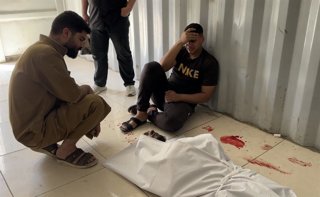 June 13, 2026, Nusairat, Gaza Strip, Palestinian Territory: Paramedics transport the body of a Palestinian man and several wounded individuals to Al-Awda Hospital in Nuseirat, central Gaza Strip, on June 13, 2026, following an Israeli attack targeting mun