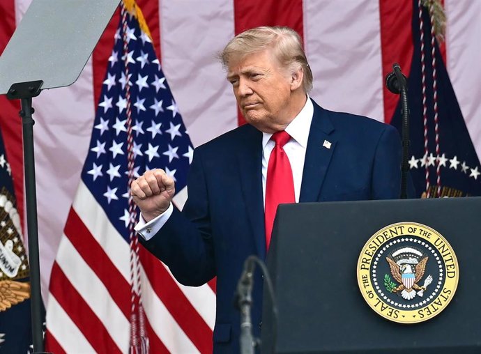 United States President Donald J Trump gestures as he delivers remarks in the Amphitheater after laying a wreath at the Tomb of the Unknowns  at Arlington National Cemetery in Arlington, Virginia on Memorial Day, Monday, May 25, 2026.