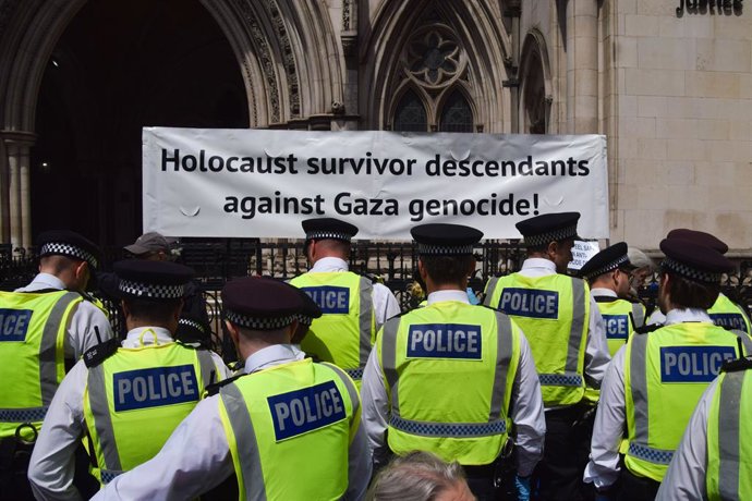 June 15, 2026, London, England, United Kingdom: Police officers arrest protesters sitting under a banner stating 'Holocaust survivor descendants against Gaza genocde' outside the Royal Courts of Justice as the ban on the activist group Palestine Action is