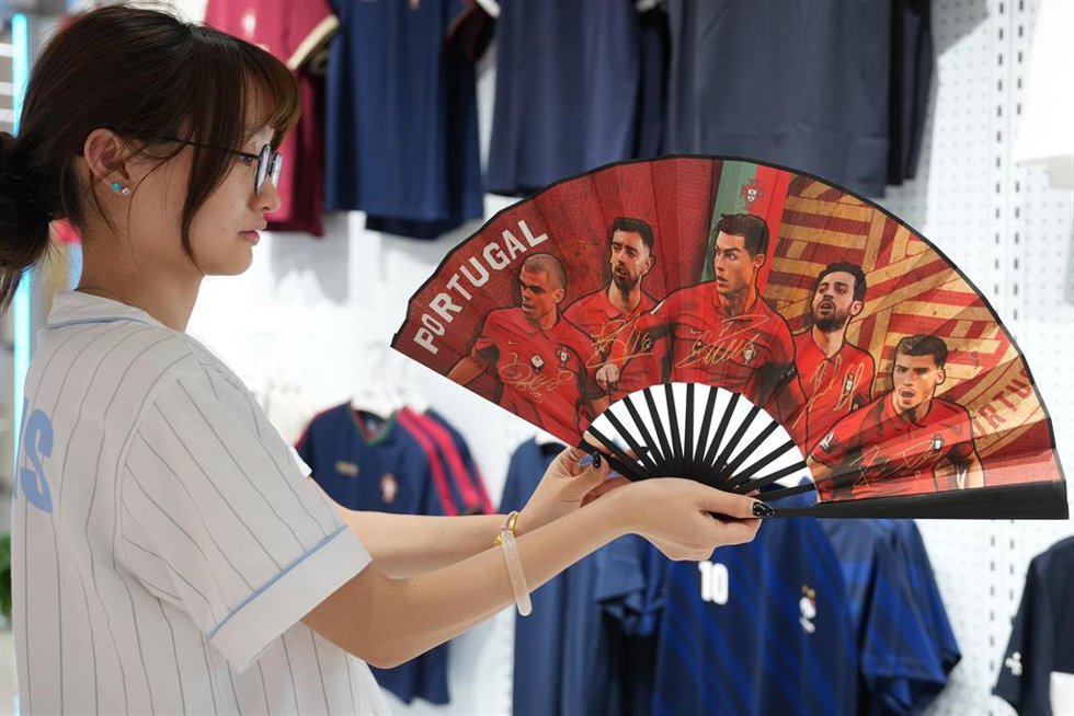 BEIJING, June 6, 2026  -- A vendor displays World Cup-themed merchandise