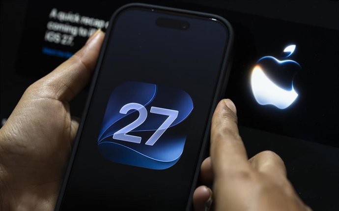 June 10, 2026: In this photo illustration, a person interacts with a smartphone displaying the iOS 27 logo on June 10, 2026, in New Delhi, India.